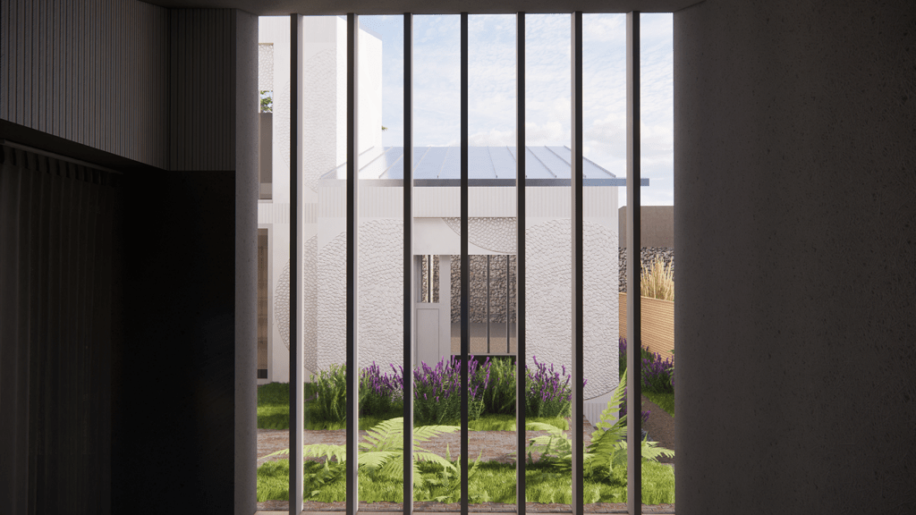 A view through a window into a small courtyard garden.