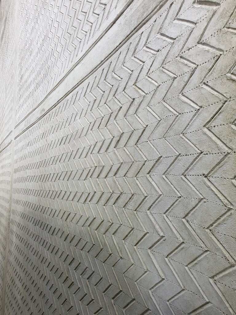 Pargetting; an abstract geometric pattern on lime render in Suffolk.